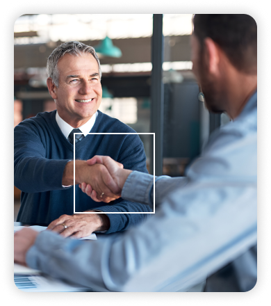 Smiling colleagues shaking hands