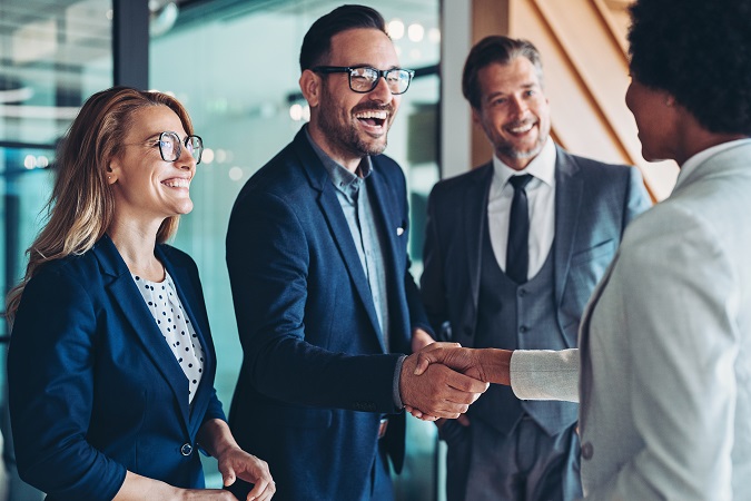 Businesspeople greeting each other with a handshake