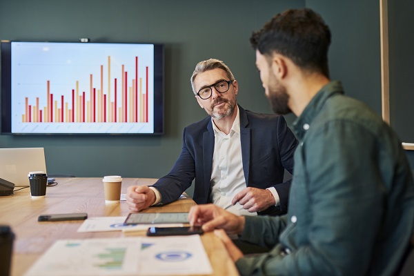 Business professionals having a discussion in a modern office