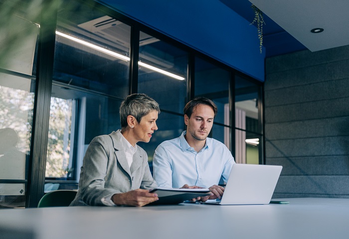 Colleagues discussing a project in the office
